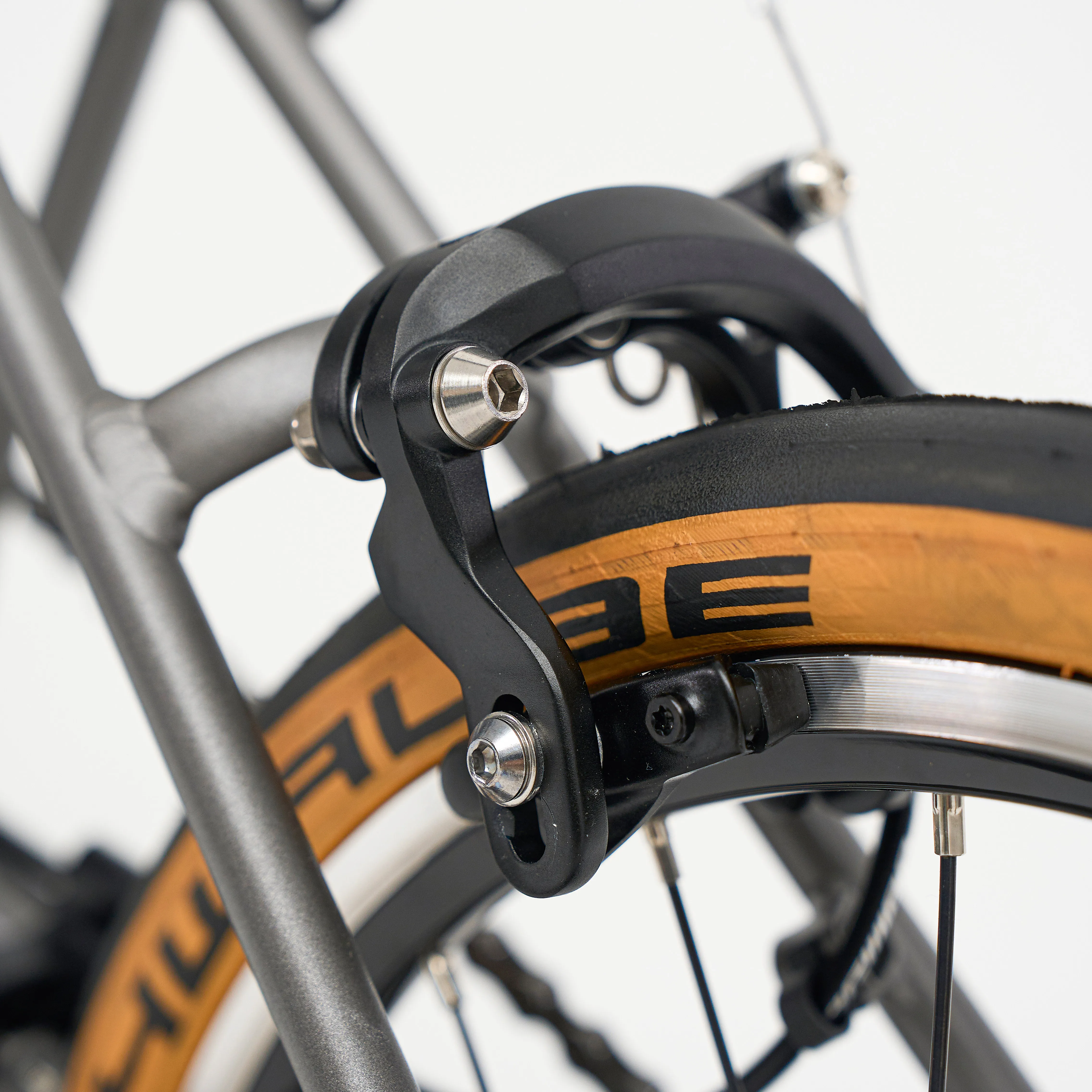 Aerra forged alloy brake calliper close-up with Schwalbe Kojak tan-wall tyre