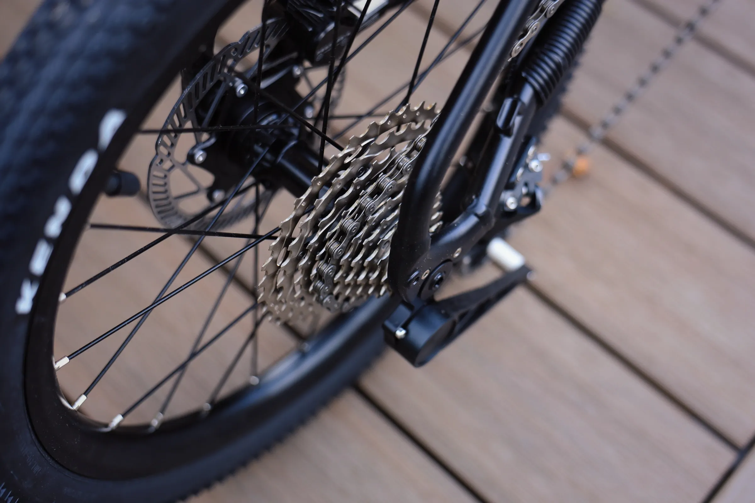 Gravon 10-speed cassette and rear derailleur detail, photographed close up in natural light