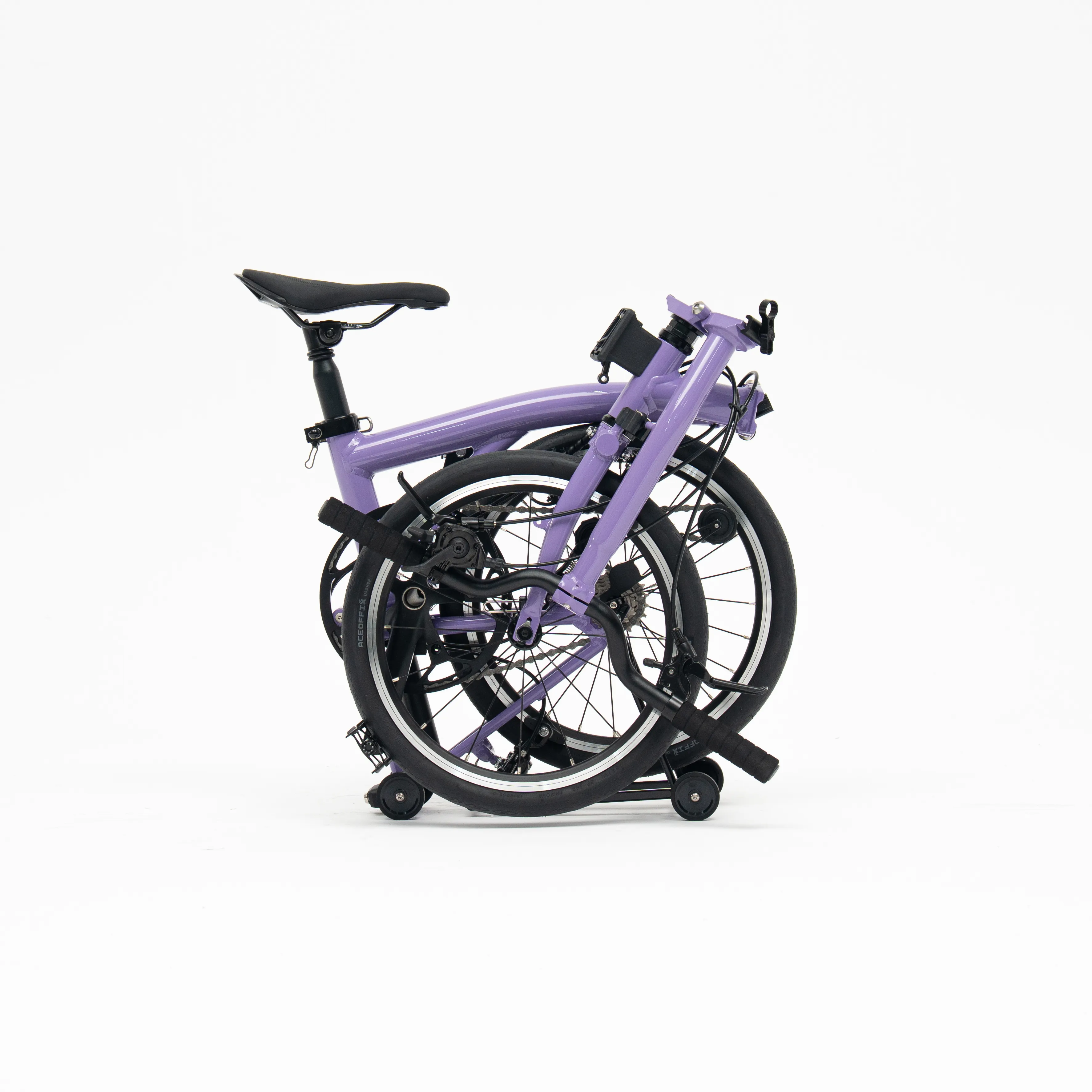 Lumio folding bike, Lilac colourway, folded white-background studio shot