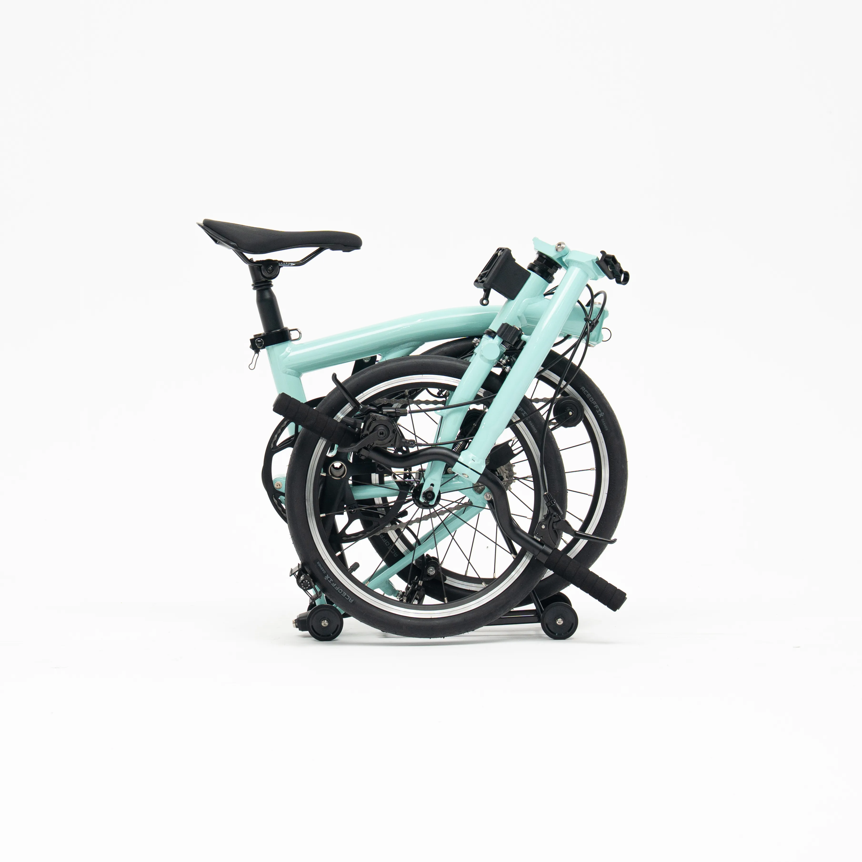 Lumio folding bike, Mint colourway, folded white-background studio shot