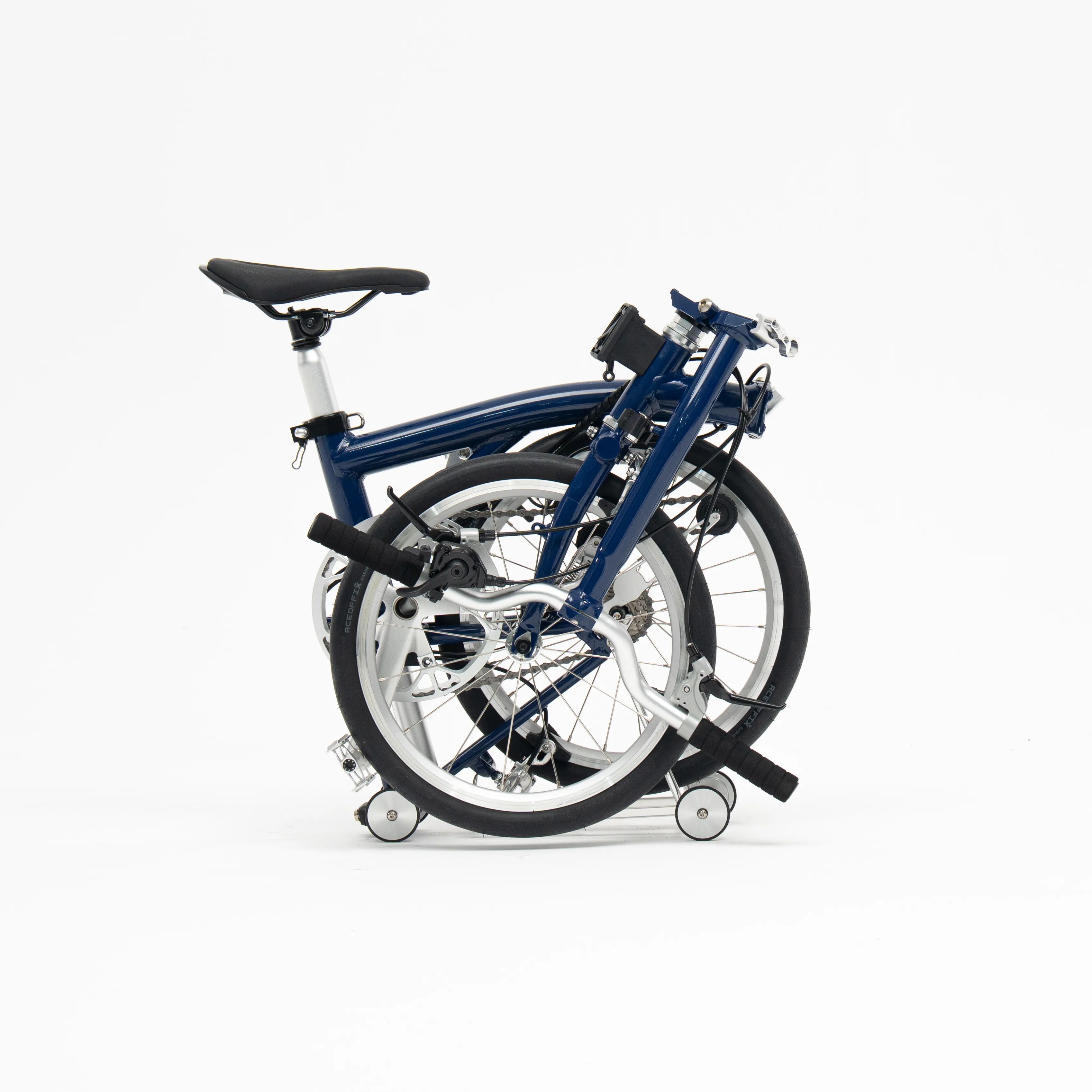 Lumio folding bike, Navy colourway, folded white-background studio shot